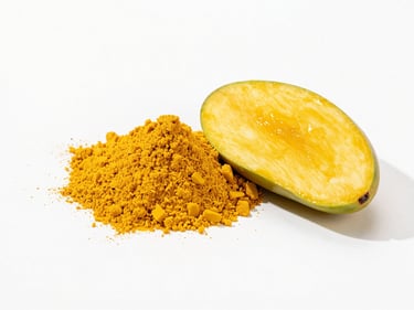 Clean minimalist shot of vibrant yellow mango powder next to a fresh raw mango slice, bright daylight.