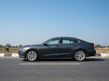 A modern dark sedan parked on an open highway near Delhi, clear blue sky, sharp daylight, cinematic automotive composition