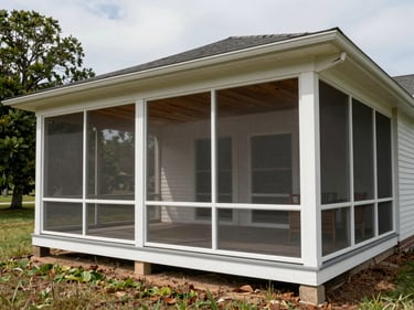 Finished screened porch on a Delaware home photographed in overcast daylight, showing full structure from the yard, screen panels, painted columns, and wood ceiling detail