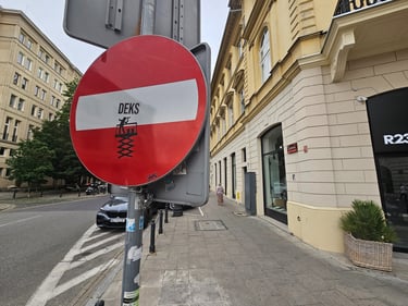 a red and white sign with a red and white stripe