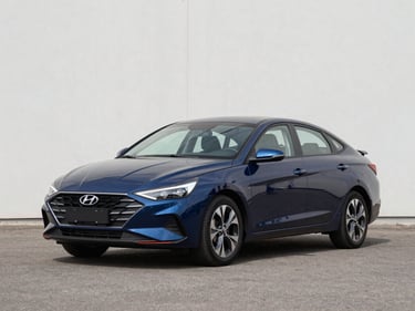 Three-quarter front view of a clean 2022 Hyundai Elantra in deep blue on a bright outdoor lot under even daylight, neutral asphalt background, no people