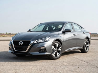 Three-quarter front view of a clean 2021 Nissan Altima in dark gray on a bright outdoor lot under even daylight, neutral asphalt background, no people