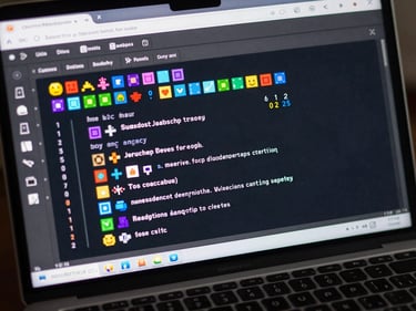 Close-up of a browser window showing a colorful JavaScript game menu — pixel art tiles and a score counter visible on a dark game canvas, keyboard keys in frame
