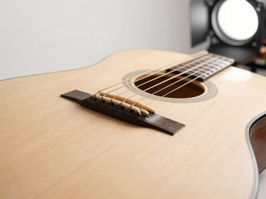 Close-up of premium acoustic guitar strings and bridge, pristine wood grain, studio key light