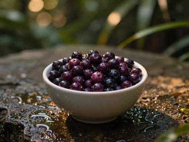 A small bowl of fresh dark purple açaí berries on a wet stone surface, water droplets, moody lighting with deep shadows, 35mm.