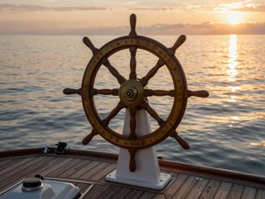 Boat helm and deck overlooking calm coastal water at golden hour, warm reflections on the water surface