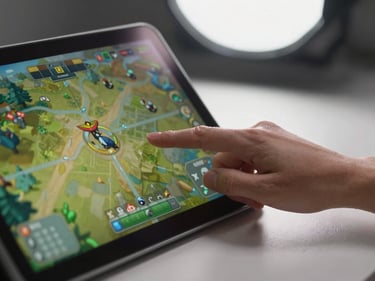 Close-up of a mouse hand navigating a strategy game interface on screen, diffused studio overhead light, clean desk surface