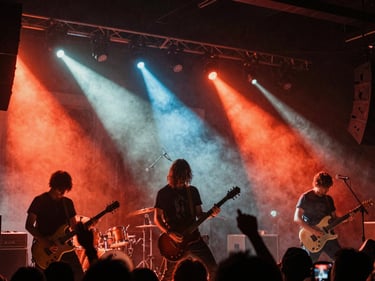 Energetic live concert photography, rock band on stage, raw stage lights cutting through haze, high contrast, gritty