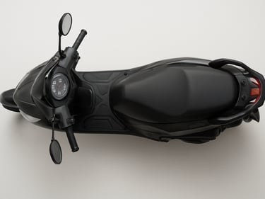 Overhead studio shot of a 125cc commuter scooter, neutral white surface, even daylight, full scooter visible from above showing floorboard and handlebar layout