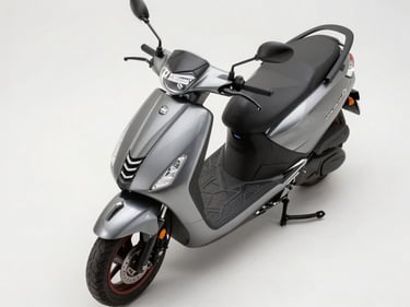 Overhead studio shot of a 125cc premium scooter, neutral white surface, even daylight, full scooter from above showing LED headlight and front apron design