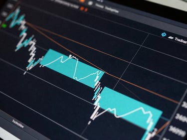 Close-up of a TradingView chart showing institutional order block zones highlighted in cyan rectangles, dark background, no people, precise technical annotation lines
