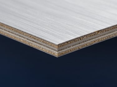 Macro close-up of F17 formply edge-sealing chemistry, showing the dense multi-layered cross-laminated timber grain, sharp technical focus.