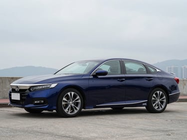 Front three-quarter driver-side profile of a midnight blue Honda Accord, overcast Hong Kong daylight, full vehicle visible, squared frame, no tilt