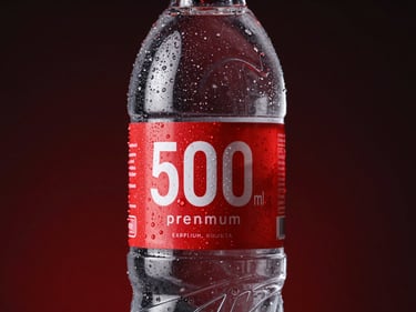 Studio product shot of a 500ml premium PET water bottle, crisp condensation droplets, custom crimson label.
