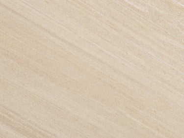 Overhead macro of Travertino Classico slab — warm ivory with characteristic pore structure and linear banding, studio strobe overhead, tight orthographic crop