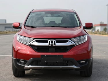 Head-on close-up of a red 2019 Honda CR-V parked on an empty lot, bright overcast daylight, crisp front detail, no people