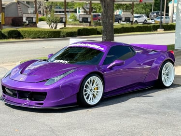 a purple car parked on the side of a street