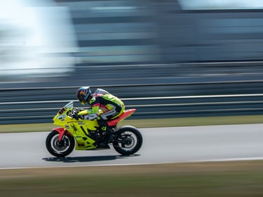 a person riding a motorcycle on a track