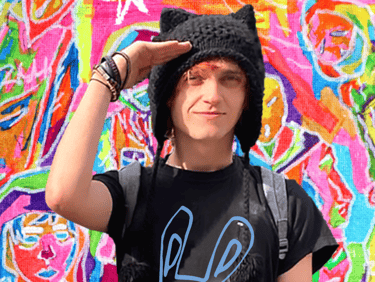 Reid Gorecki wearing a Reid Gore shirt and saluting in a cat hat