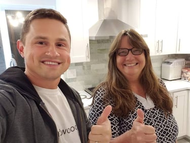 Water damage home restoration. Kitchen remodel featuring custom stained hardwood floors in Mill Creek