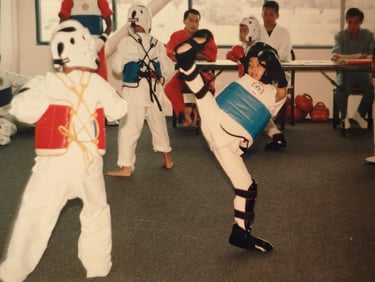 attempting to kick my opponent's face as he casually watches from afar