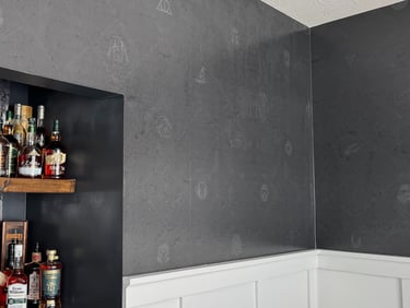 Modern home bourbon shelf and bar with dark textured custom wallpaper and wooden floating shelves