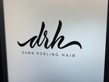 Frosted glass door with custom black Dawn Robling Hair logo decal installed by Big Sticker