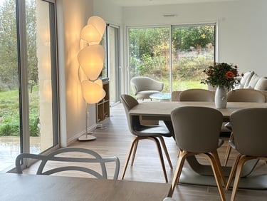 a dining room with a table and chairs