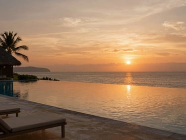Infinity pool of a premium beachfront resort in Lombok overlooking the ocean at sunset, warm orange sky, soft shadows, editorial travel photography