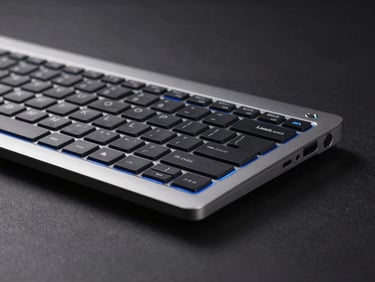Close-up of a Dell Latitude 5400 keyboard and chassis, dark minimalist studio background, electric blue accent lighting, crisp tech details, 85mm lens