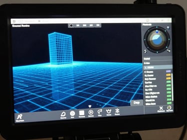 Macro close-up of a real-time virtual camera interface, displaying Unreal Engine viewport telemetry, wireframe grid overlays, and cool blue digital lighting.