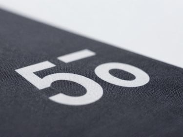 Macro shot of a detailed DTF transfer on a dark fabric, sharp focus, clean texture, bright lighting