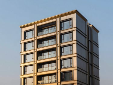 Twilight architectural photography of DLF Magnolias exterior, clean geometric lines, champagne gold accents, 35mm