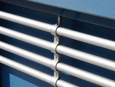 Close-up of a modern automated garage door mechanism, clean metallic rails, bright natural daylight