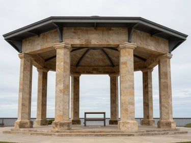 Symmetrical architectural photography of a civic pavilion made of warm limestone and steel, overcast sky, 35mm