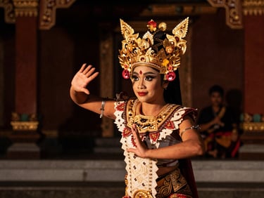Traditional Javanese dancer performing at the Kraton Yogyakarta palace, intricate gold headpiece, dramatic warm lighting, dark background