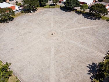 Aerial drone photography of a clean geometric land plot in northern Veracruz, bright natural daylight, sharp focus, 35mm