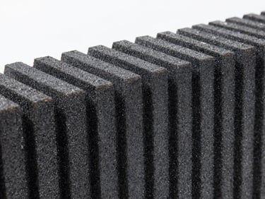 Close-up of raw weather-resistant HDPE grain texture under bright, high-contrast studio lighting, showcasing the dense polymer structure and zero-maintenance finish.