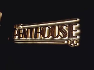 The Penthouse QC signage