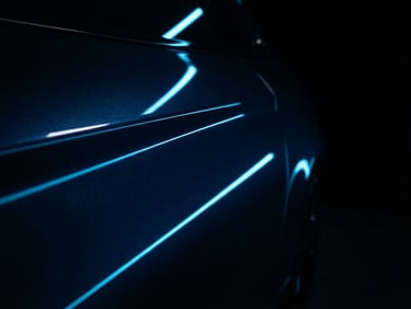 dark moody automotive photography, sharp neon blue reflections, high-contrast studio lighting, glossy metallic paint, macro lens, 35mm, close-up of a car door with linear light reflections