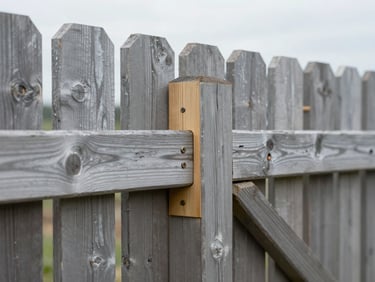 Close-up of a perfectly aligned, heavy-duty timber fence joint, damp-ready pressure-treated wood, bright overcast daylight, sharp focus