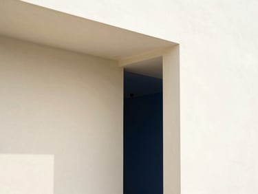 Architectural photograph of a bright modern interior with flawless matte painted walls and clean-cut lines, natural daylight, 35mm lens.