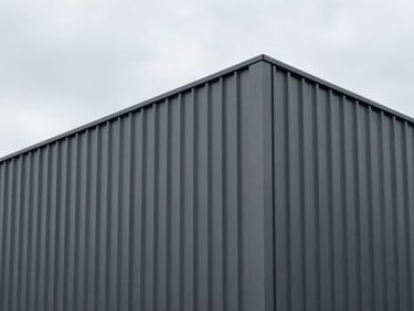 Minimalist architectural exterior showing crisp vertical metal siding panels under overcast sky