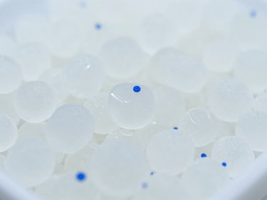 Macro shot of high-stability polymer resins, crisp industrial photography, sterile white lighting