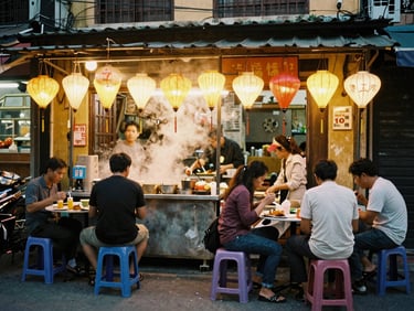 Candid shot of a steaming street food stall in Hanoi at night, warm glowing lanterns, locals eating on low plastic stools, 35mm film style