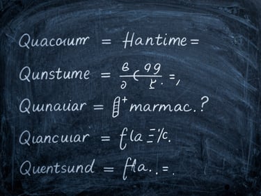 Quantum physics equations on a slate board, macro detail, blue-shifted light