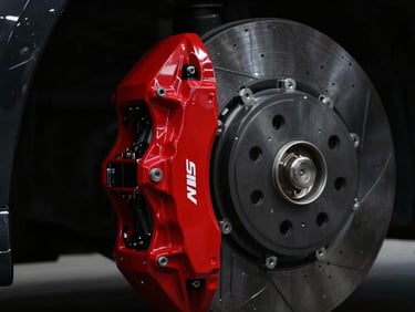 industrial automotive photography, dramatic low-key side lighting, close-up of a high-performance brake caliper, high contrast red and black tones