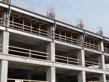 Wide environmental shot of an industrial building under construction, sharp daylight, steel beams and concrete structures visible, crisp technical focus, 35mm lens