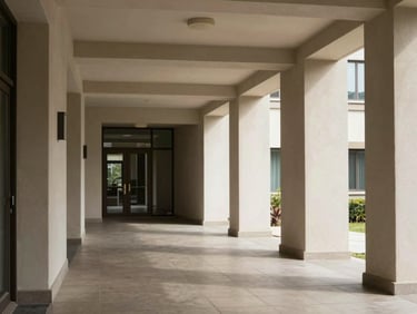 Apartment building entrance corridor, natural daylight, clean architectural lines, tiled floor, no people
