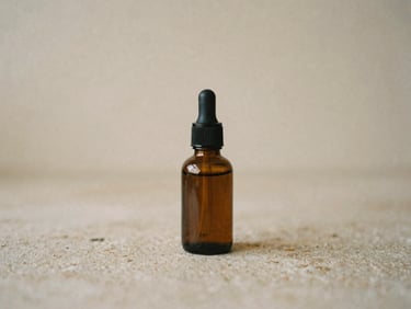 A single amber glass skincare bottle resting on a stone surface in soft morning light, warm minimalist composition, 35mm film
